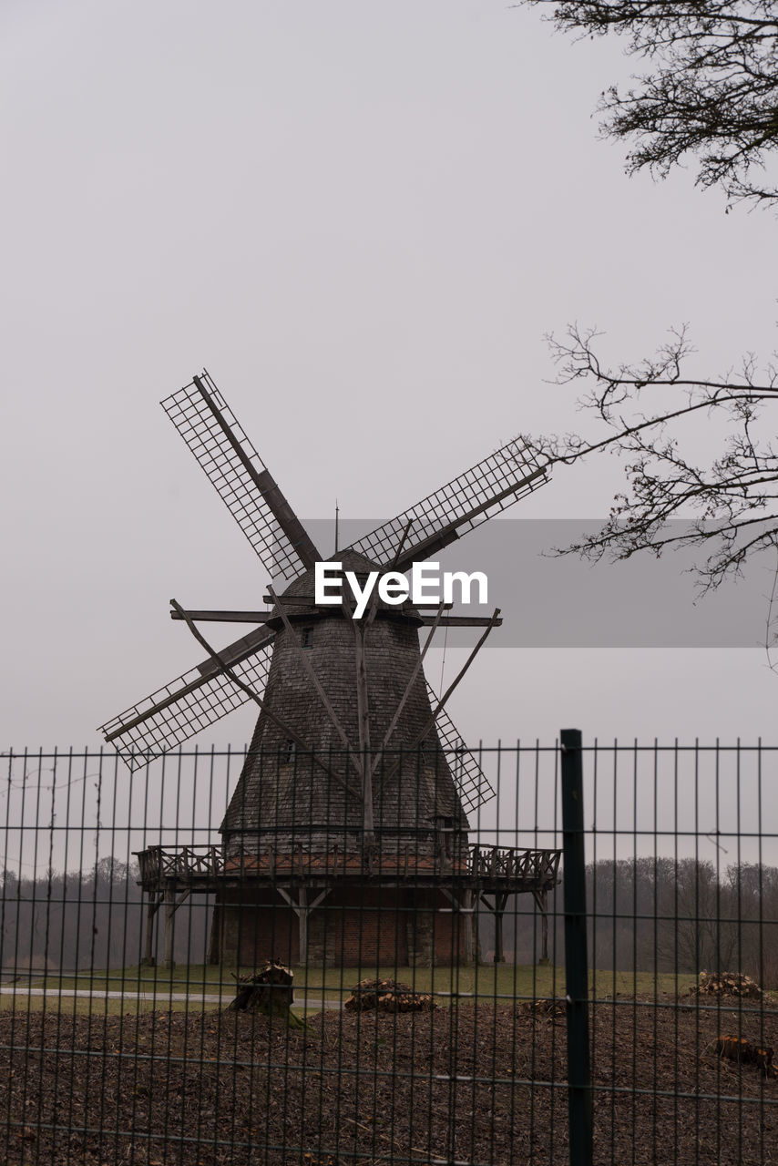 WINDMILLS AGAINST SKY