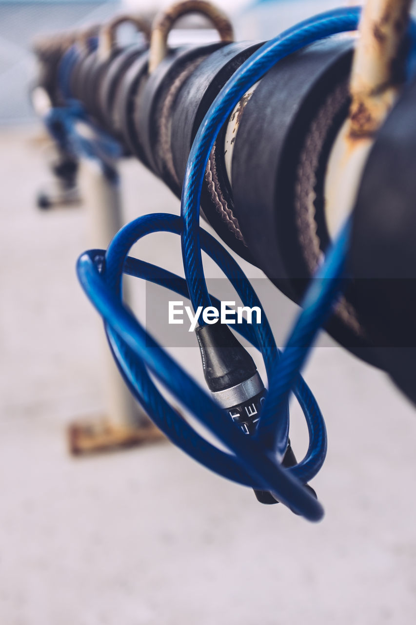 Close-up of bicycle lock on rack