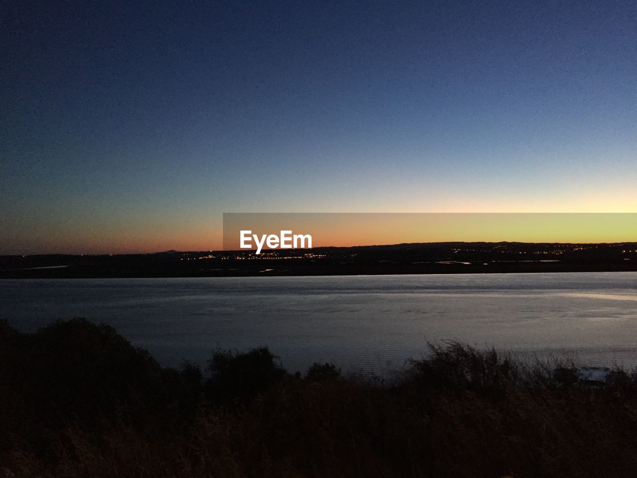 SCENIC VIEW OF RIVER AGAINST CLEAR SKY