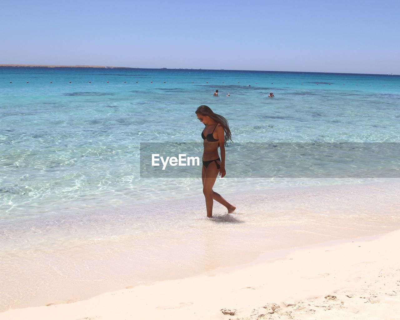 Woman wading in sea