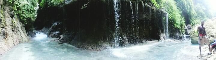 CLOSE-UP OF WATER SPLASHING ON ROCKS