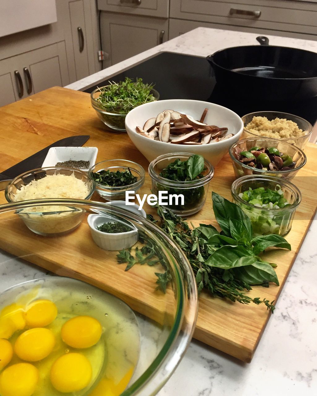 Various ingredient on cutting board at kitchen island