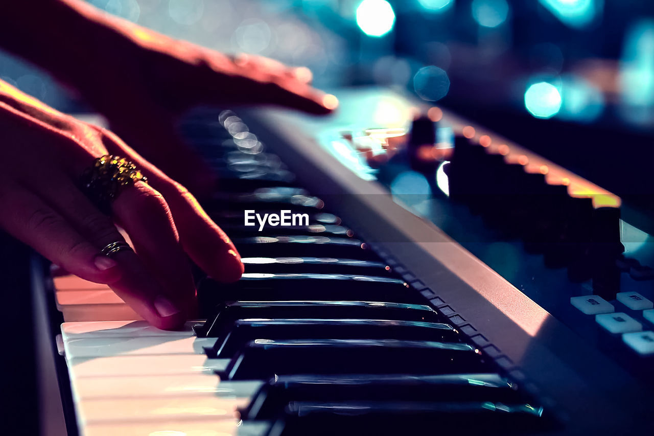 Close-up of musician playing piano