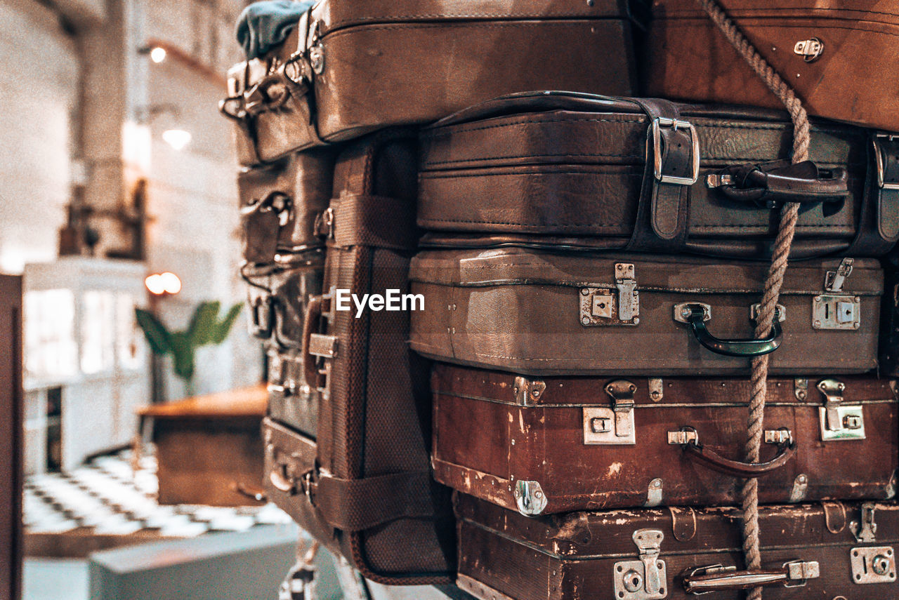 Vintage pile ancient suitcases form of tower design concept travel luggage
