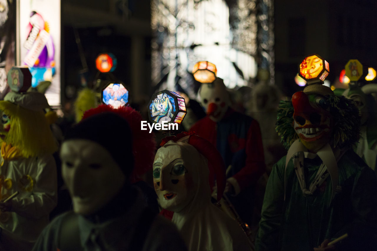 People in costumes at night
