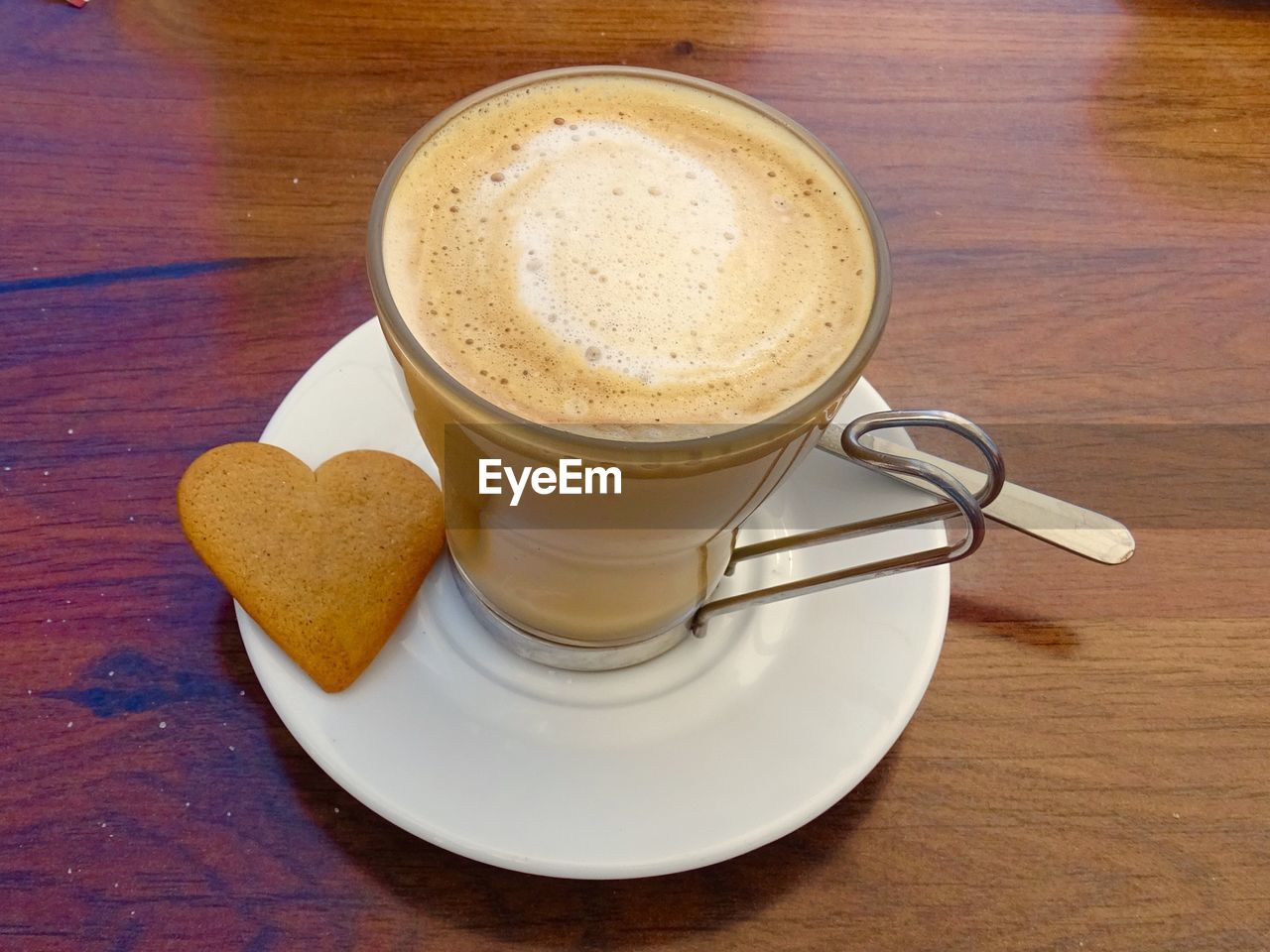 Love coffee with heart shaped biscuit
