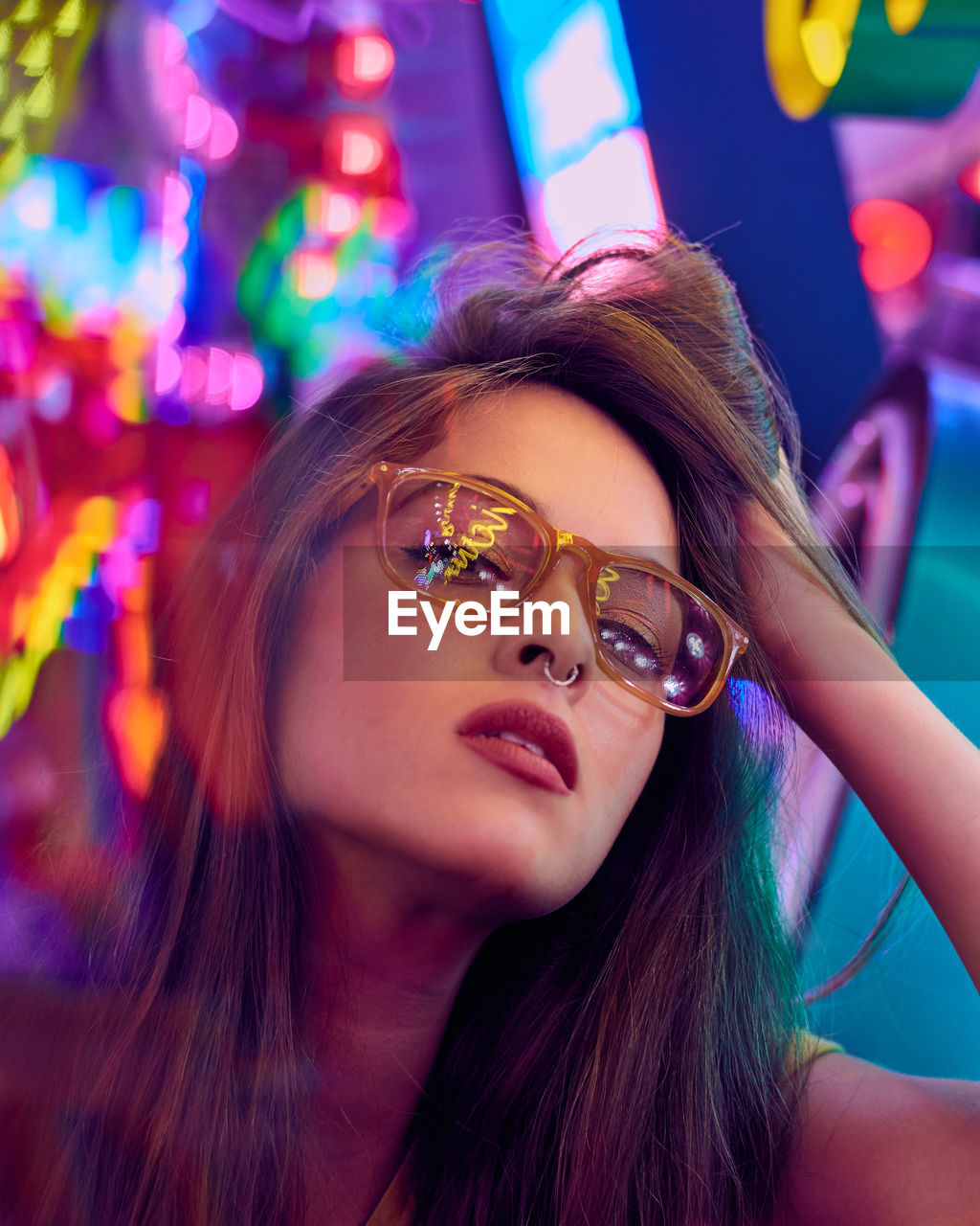 Close-up portrait of young woman wearing sunglasses