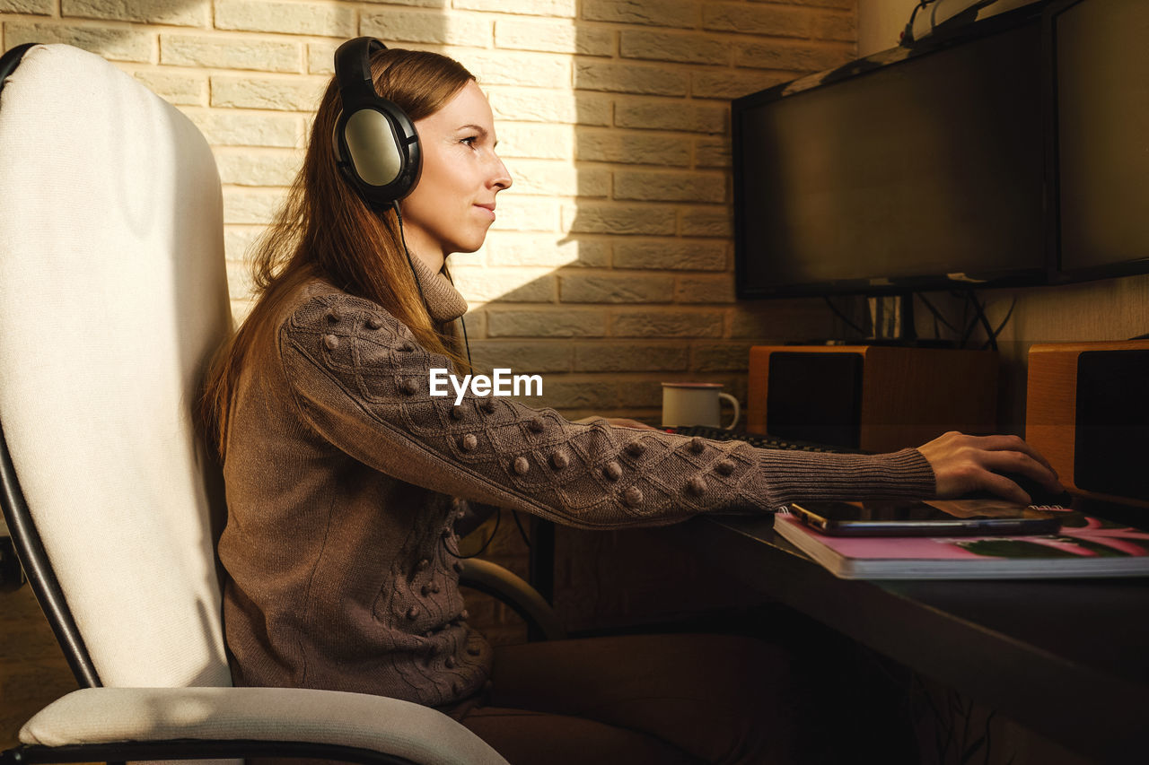 Woman using computer on table