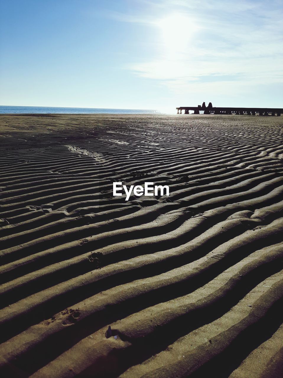 SCENIC VIEW OF SAND DUNES AGAINST SKY