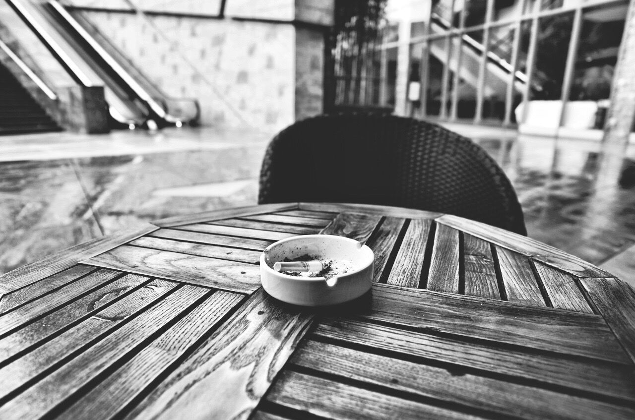 CLOSE-UP OF CUP ON TABLE