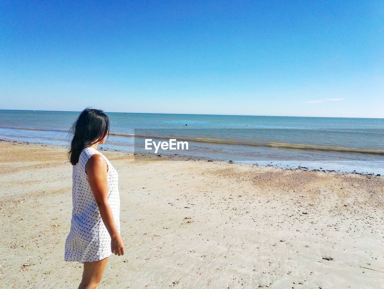 Scenic view of beach against clear sky