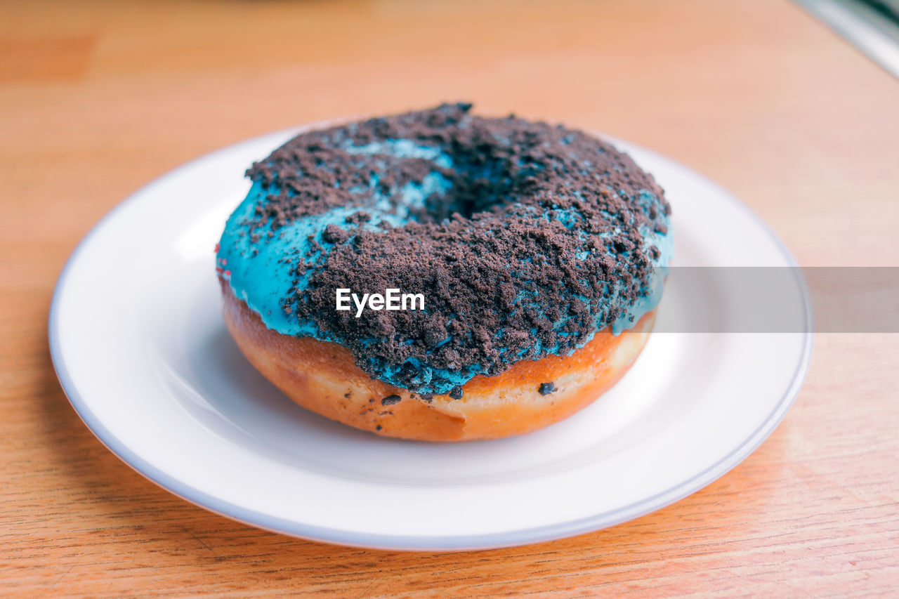 Donut in plate on table