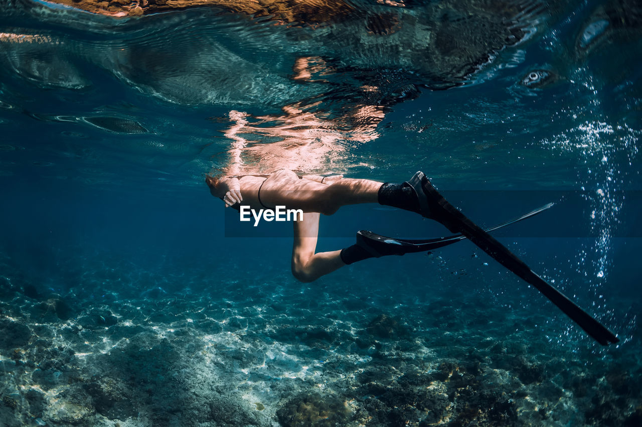 young man swimming in sea