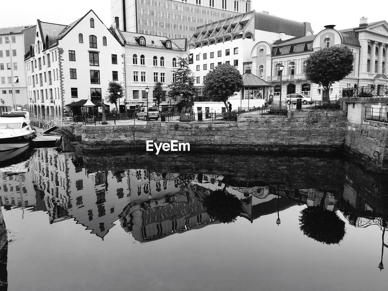 REFLECTION OF HOUSES IN WATER