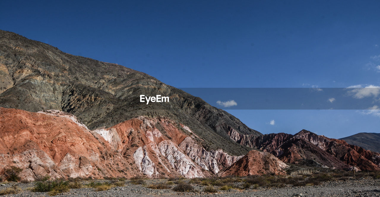 Scenic view of rocky mountains against sky