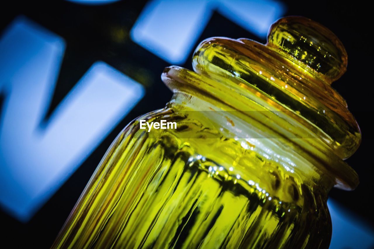 Close-up of glass jar in room