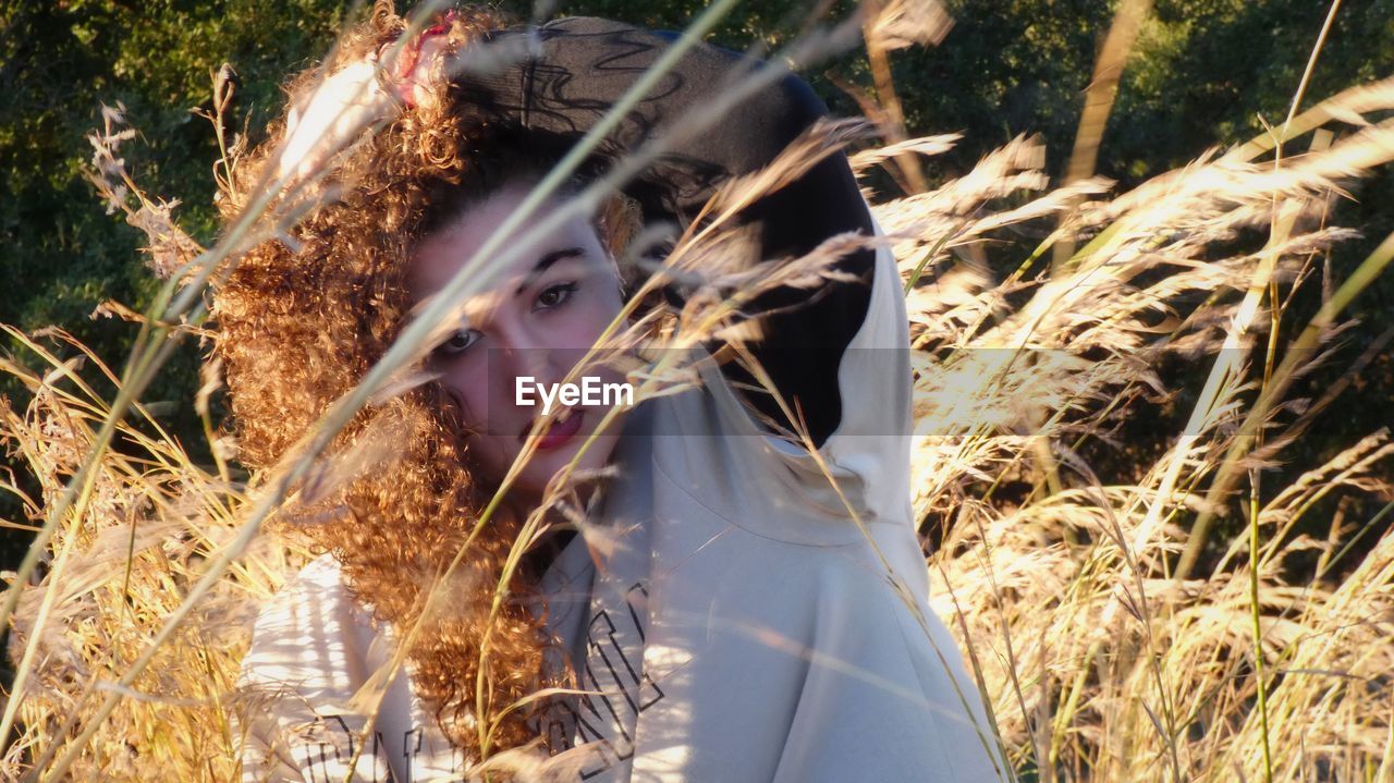 plant, one person, nature, land, portrait, grass, sunlight, autumn, day, young adult, women, field, adult, headshot, outdoors, tree, leisure activity, lifestyles, spring, growth, looking at camera, agriculture, forest, looking, hairstyle