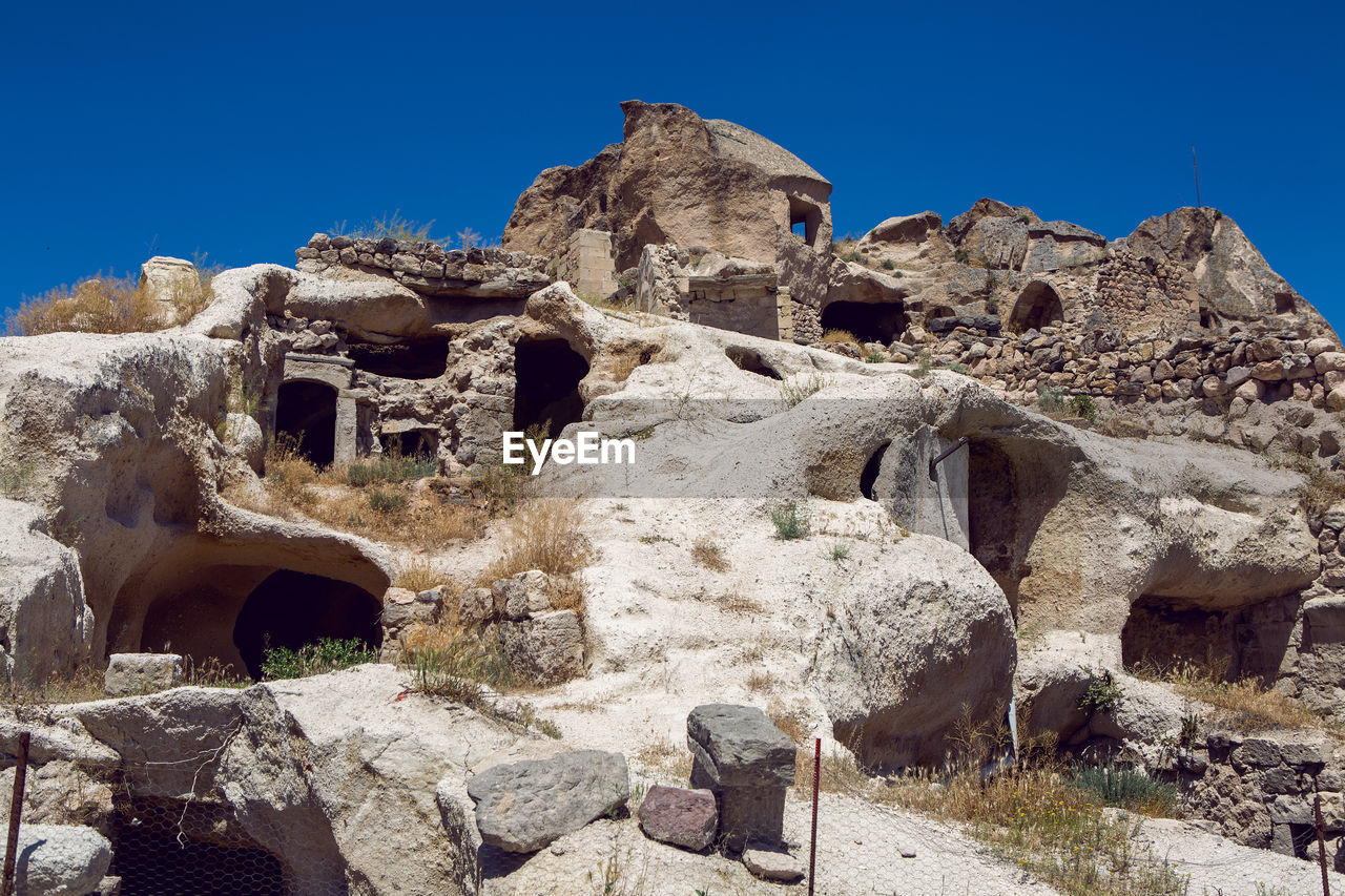 Old town of uchisar in turkey houses and the fortress in the summer in sunny weather