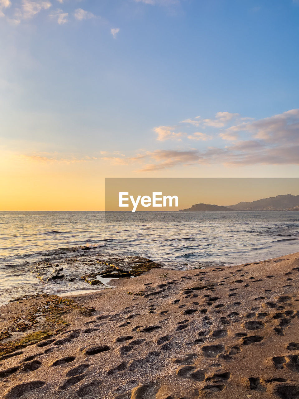sky, sea, land, water, beach, scenics - nature, sunset, beauty in nature, body of water, sand, nature, tranquility, cloud, shore, horizon, ocean, horizon over water, tranquil scene, wave, coast, sunlight, no people, idyllic, rock, environment, travel destinations, outdoors, wind wave, natural environment, sun, travel, landscape, motion, seascape, dawn, coastline, tourism, non-urban scene