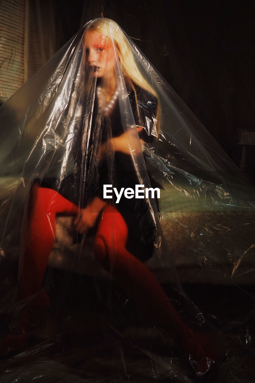 Teenage girl seen through plastic