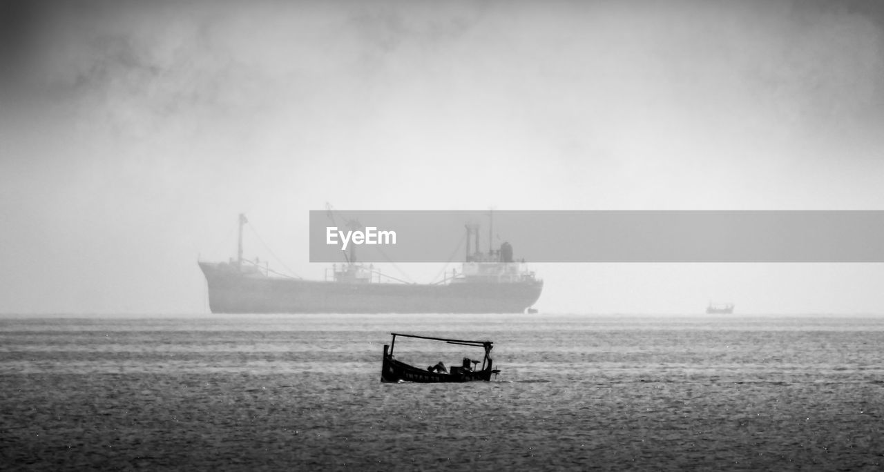 Nautical vessel on sea against sky