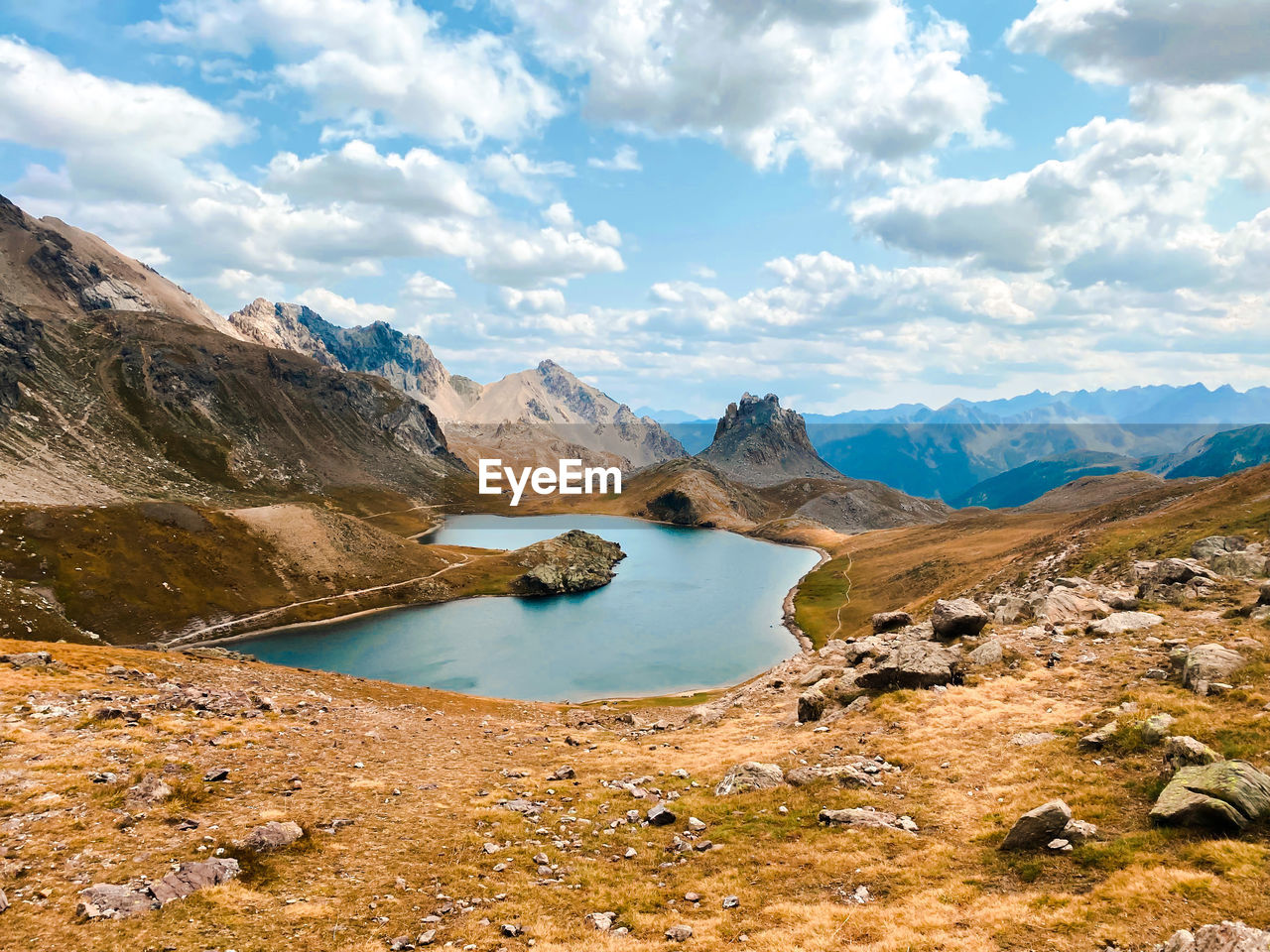 Scenic view of lake and mountains against sky