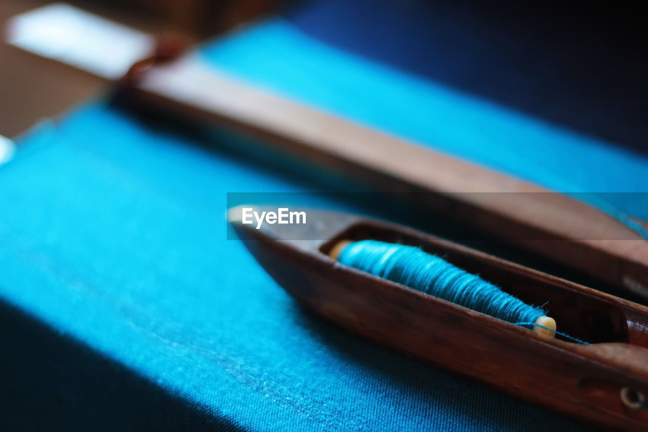 CLOSE-UP OF PENCIL ON TABLE