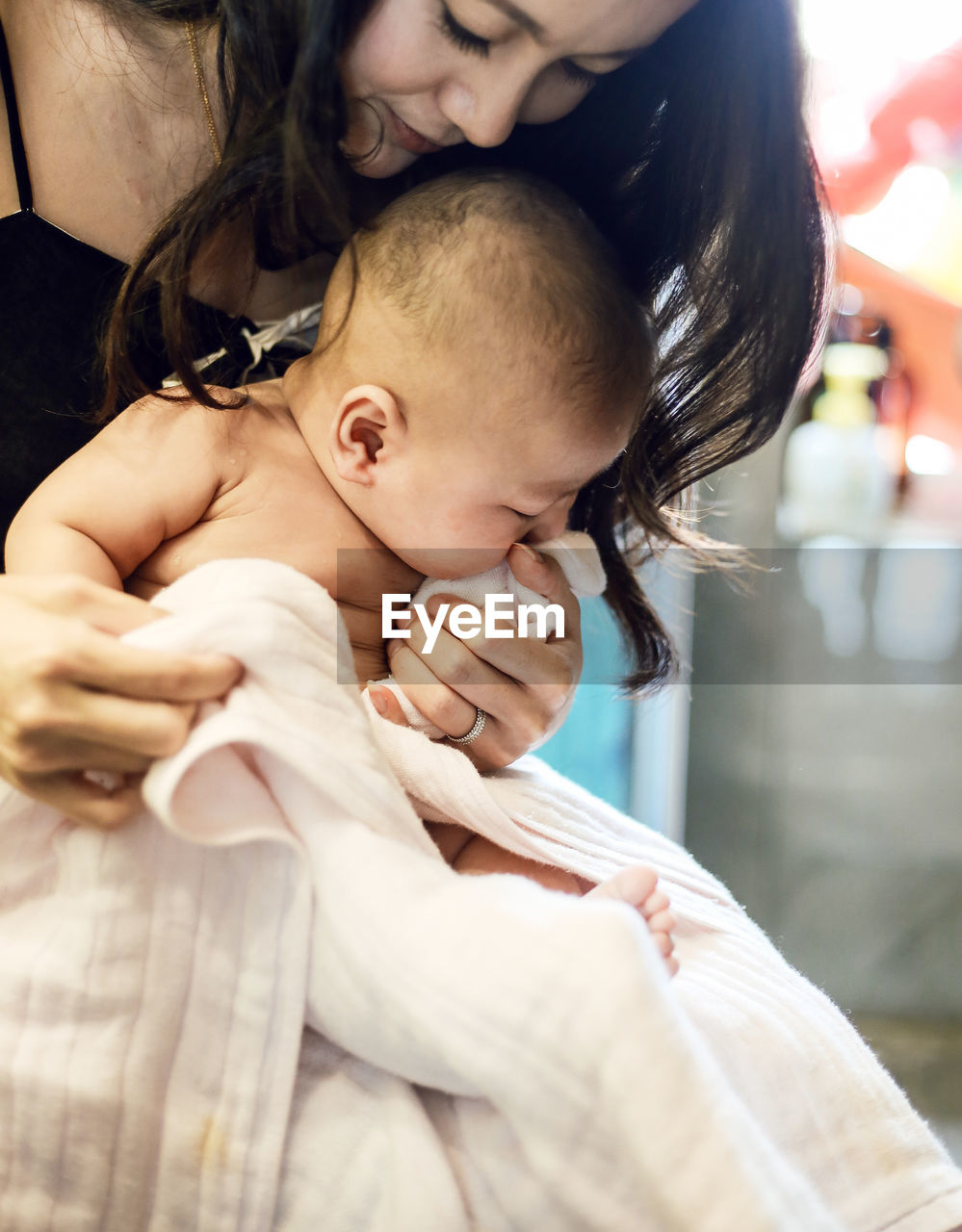 Close-up of mother holding baby