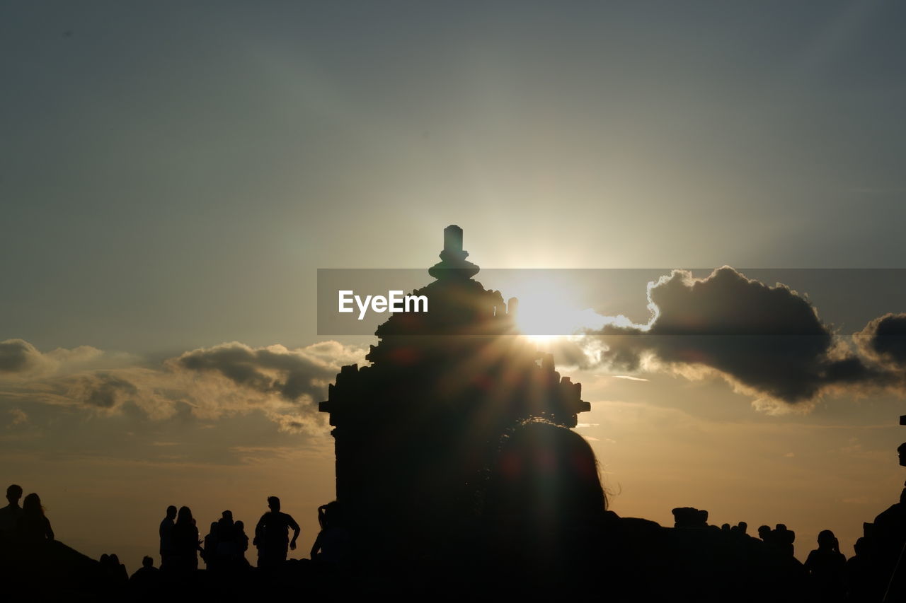SILHOUETTE PEOPLE AGAINST SKY DURING SUNSET