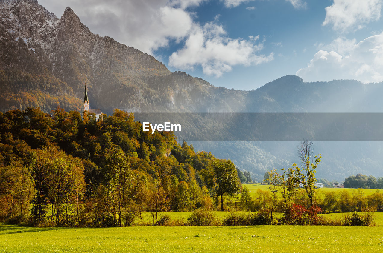 Scenic view of landscape against sky at sunset