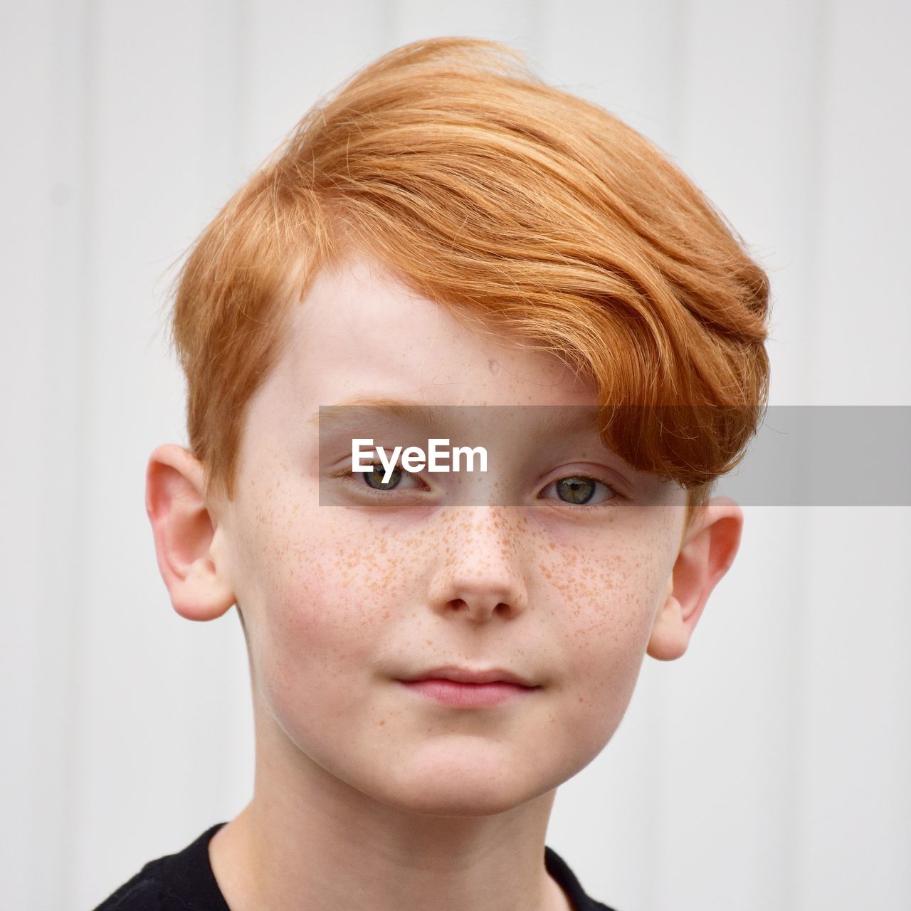 Close-up portrait of boy with redhead