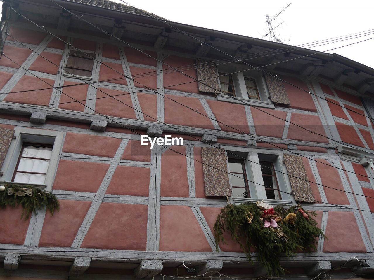 LOW ANGLE VIEW OF HOUSE WITH WINDOWS