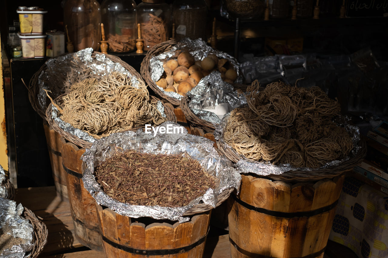 food and drink, food, container, large group of objects, retail, market, for sale, abundance, indoors, business, no people, store, variation, basket, freshness, business finance and industry, wood, market stall, arrangement, small business