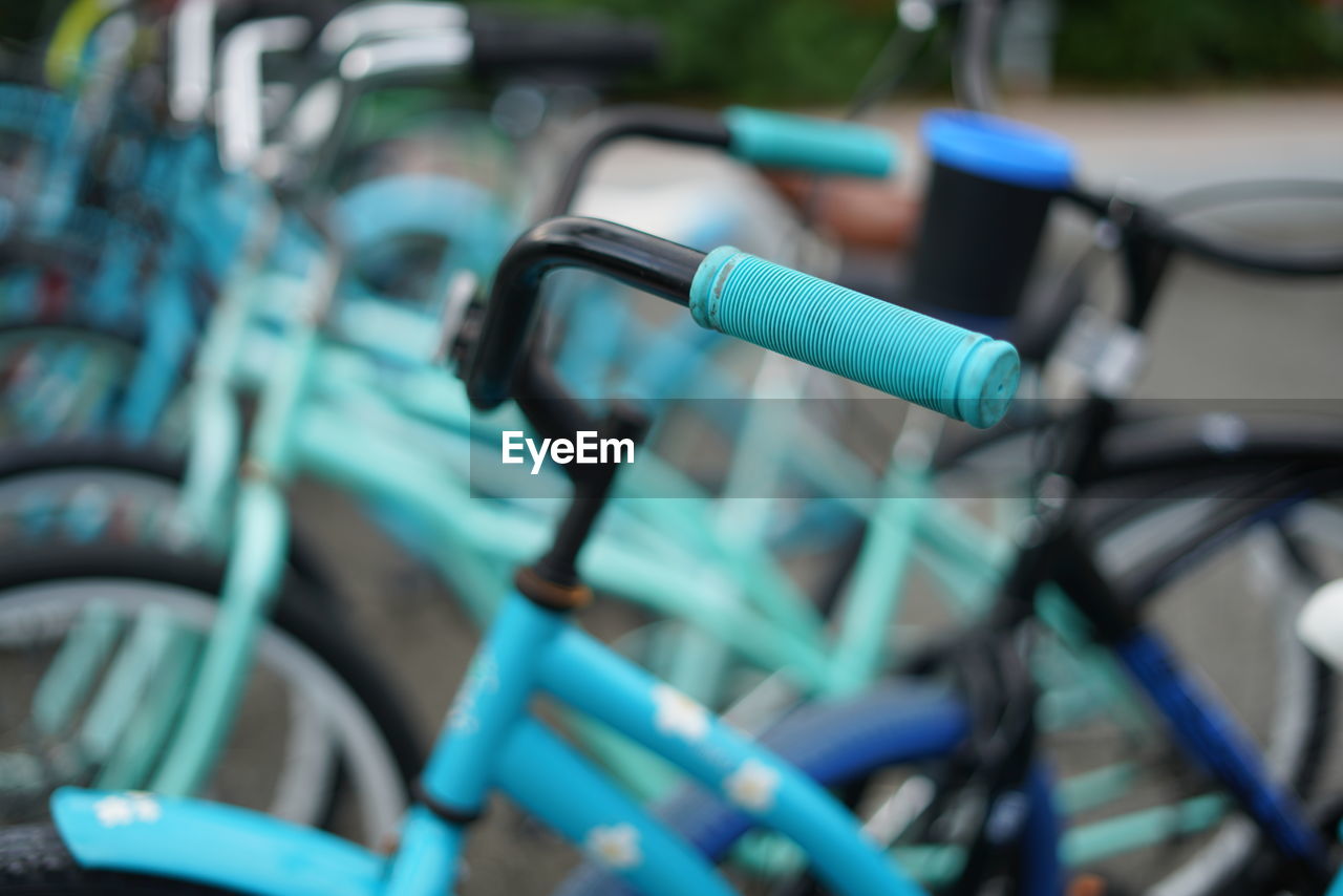 Close-up of bicycle in row