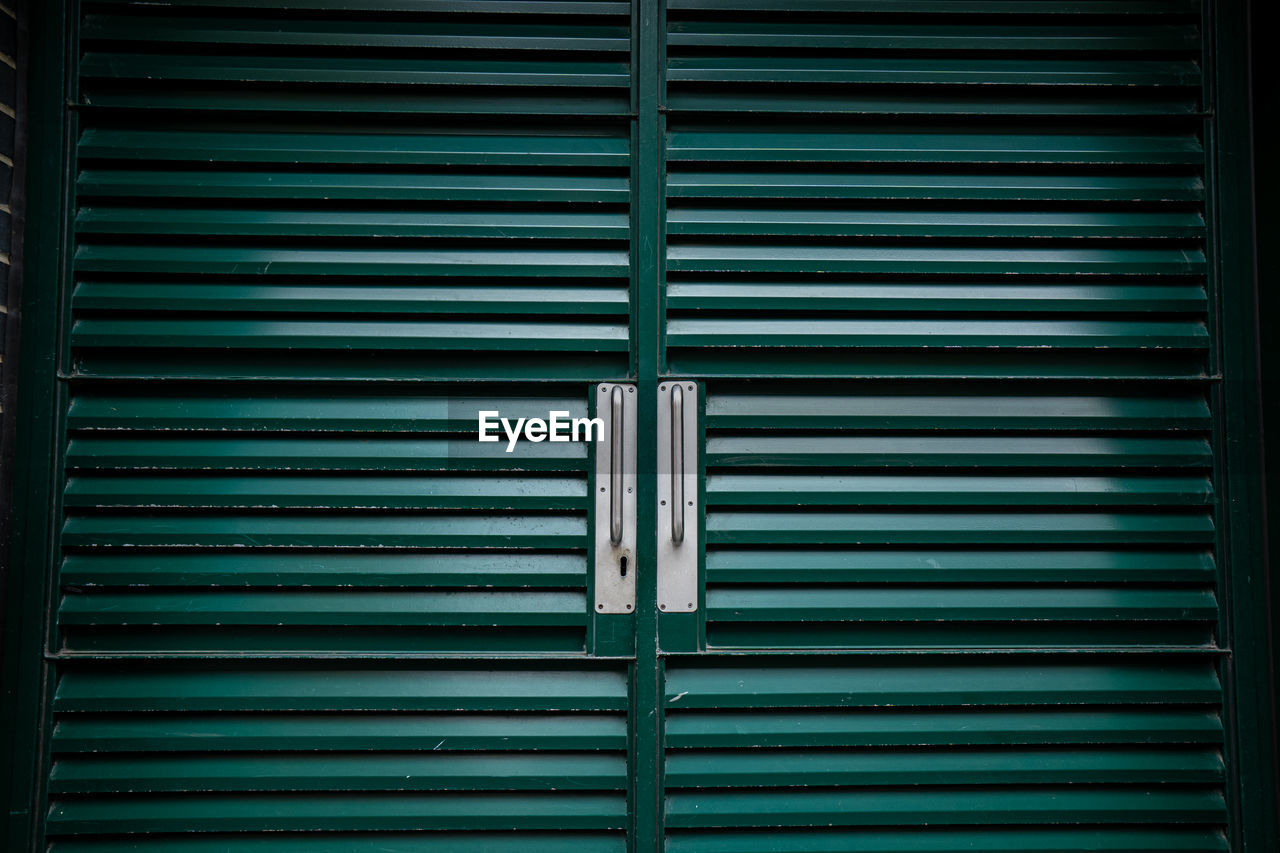 Iron doors painted green