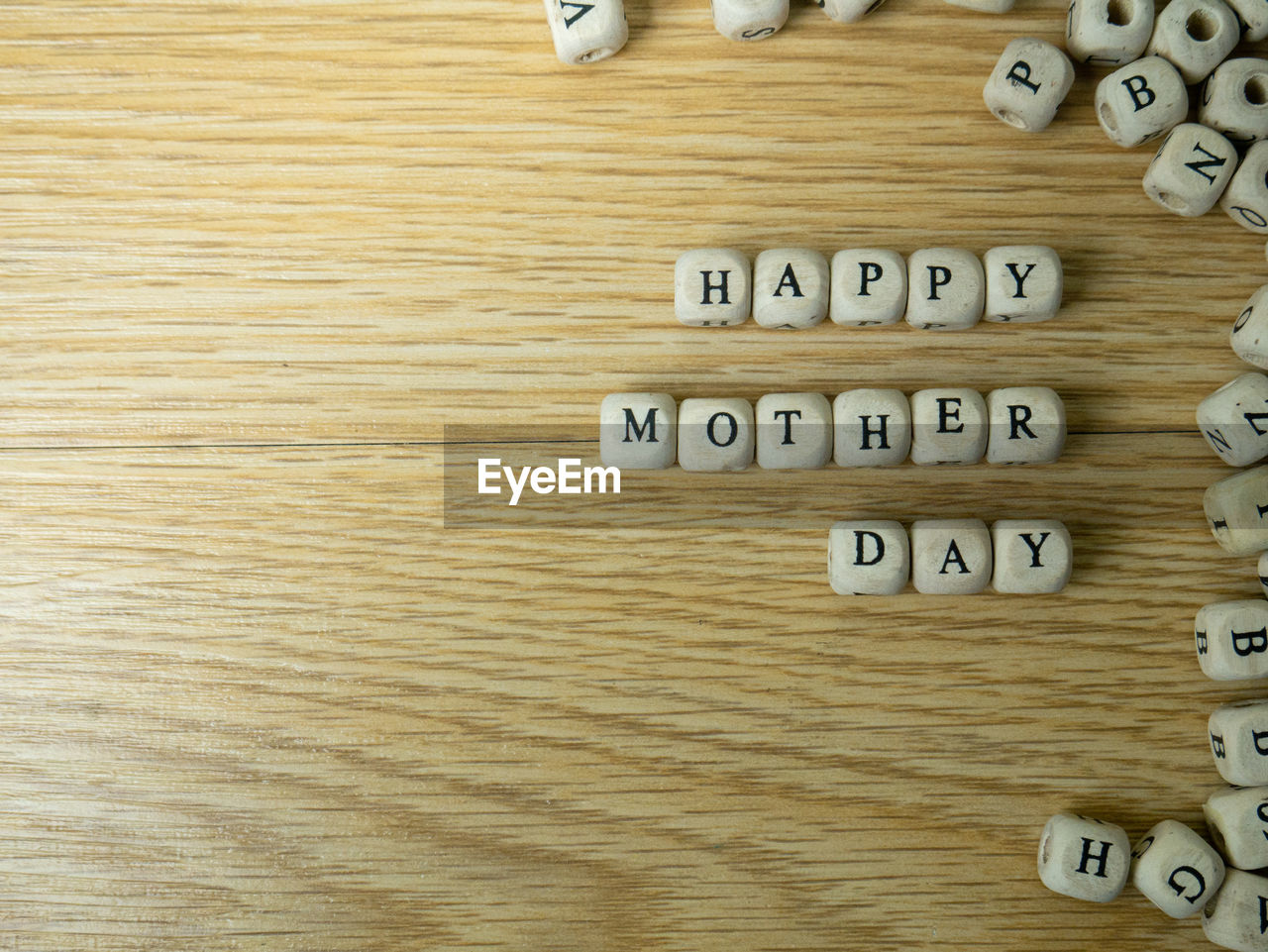 CLOSE-UP OF TEXT ON WOODEN TABLE