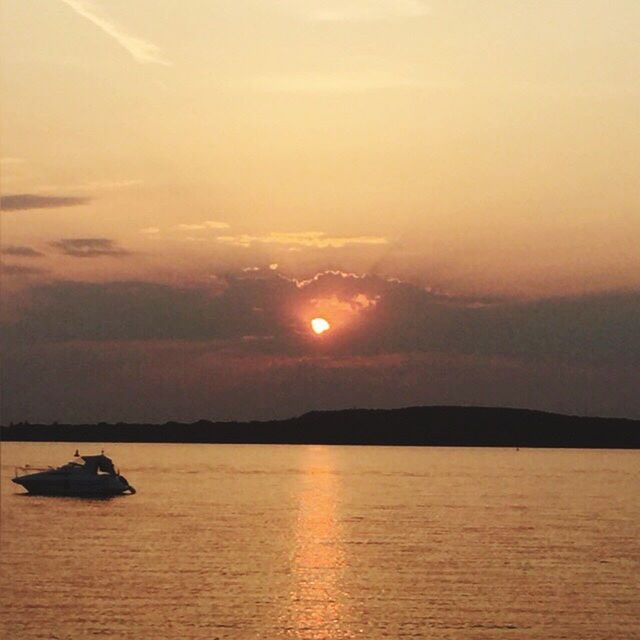 SCENIC VIEW OF SUNSET OVER SEA