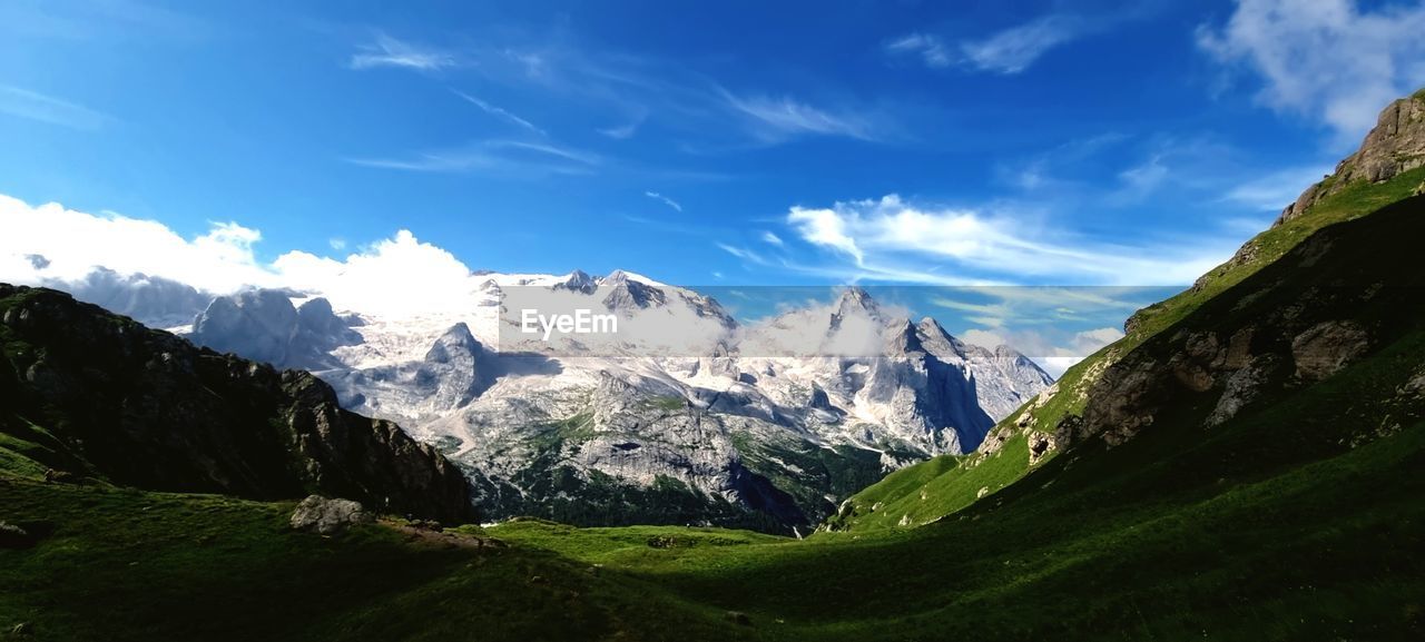 scenic view of mountains against blue sky
