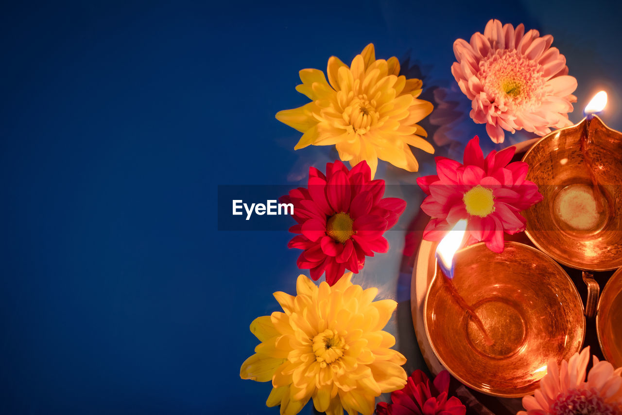 close-up of yellow flowers against orange background