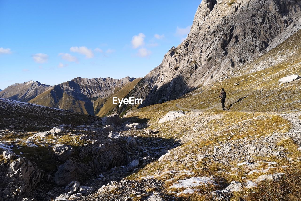  hiker in the mountains alps 