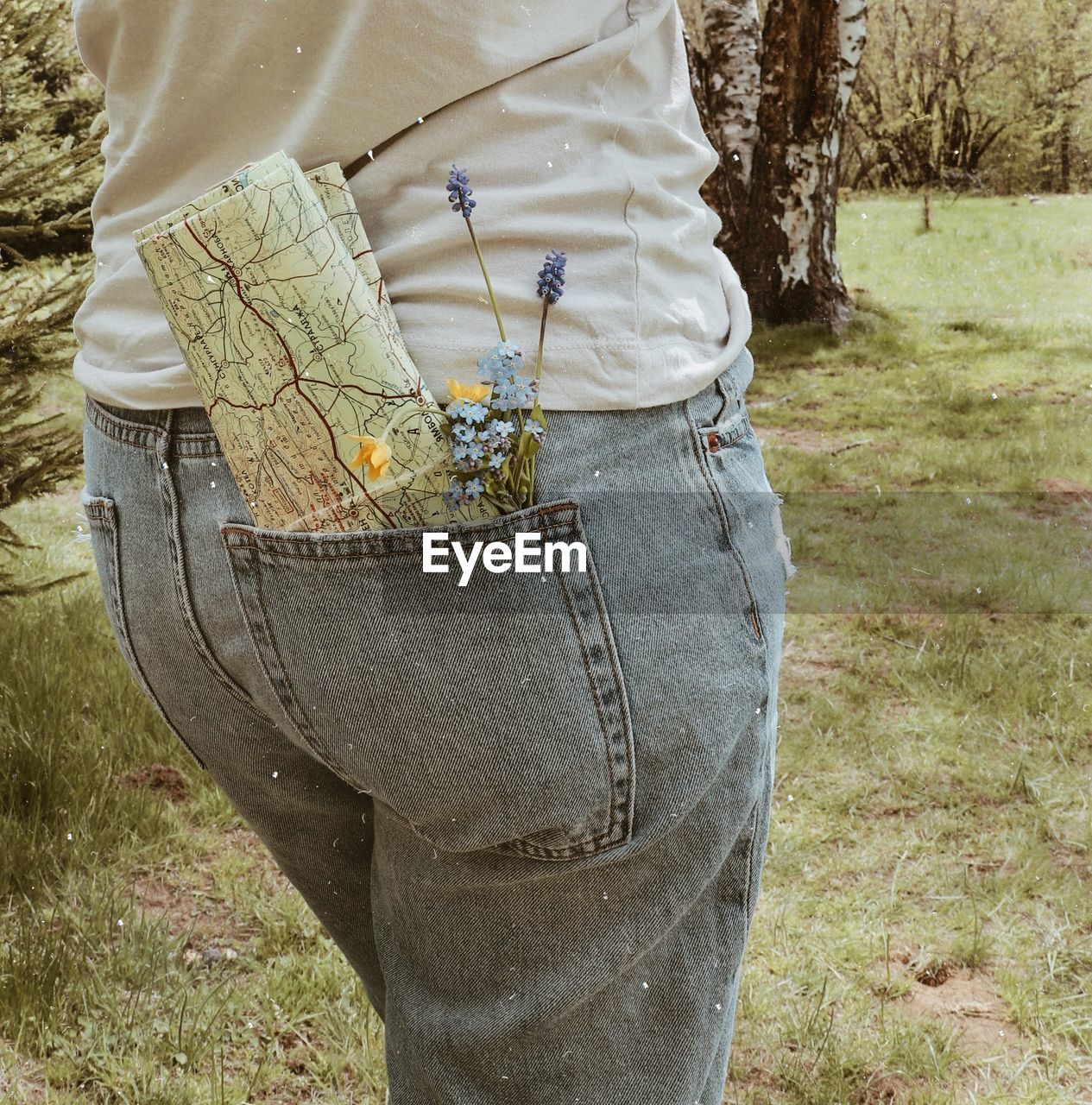 low section of woman standing on field