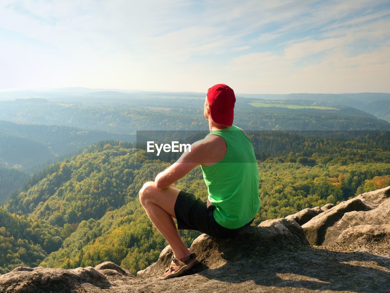 MAN LOOKING AT VIEW OF MOUNTAIN