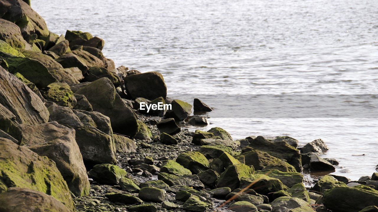 High angle view of rocks on sea