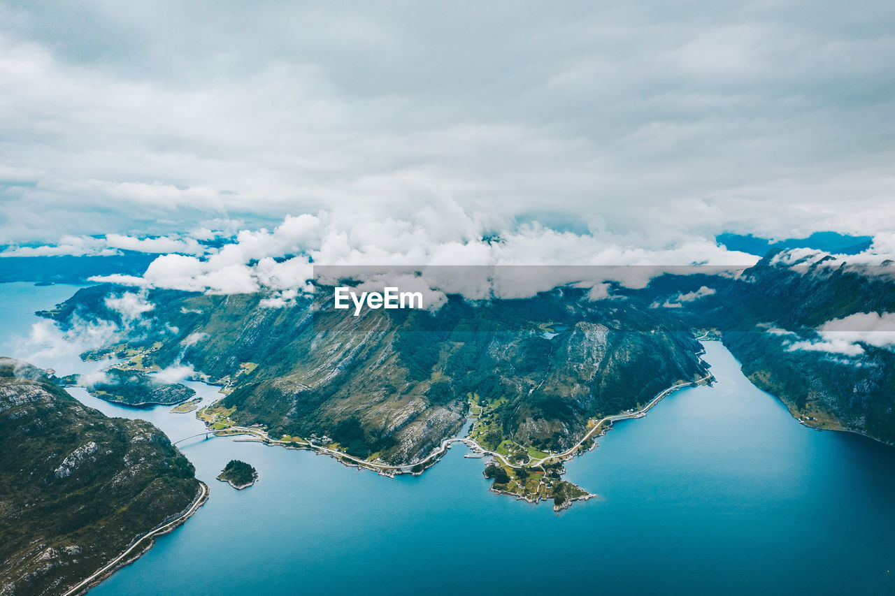 Aerial view of mountain by sea