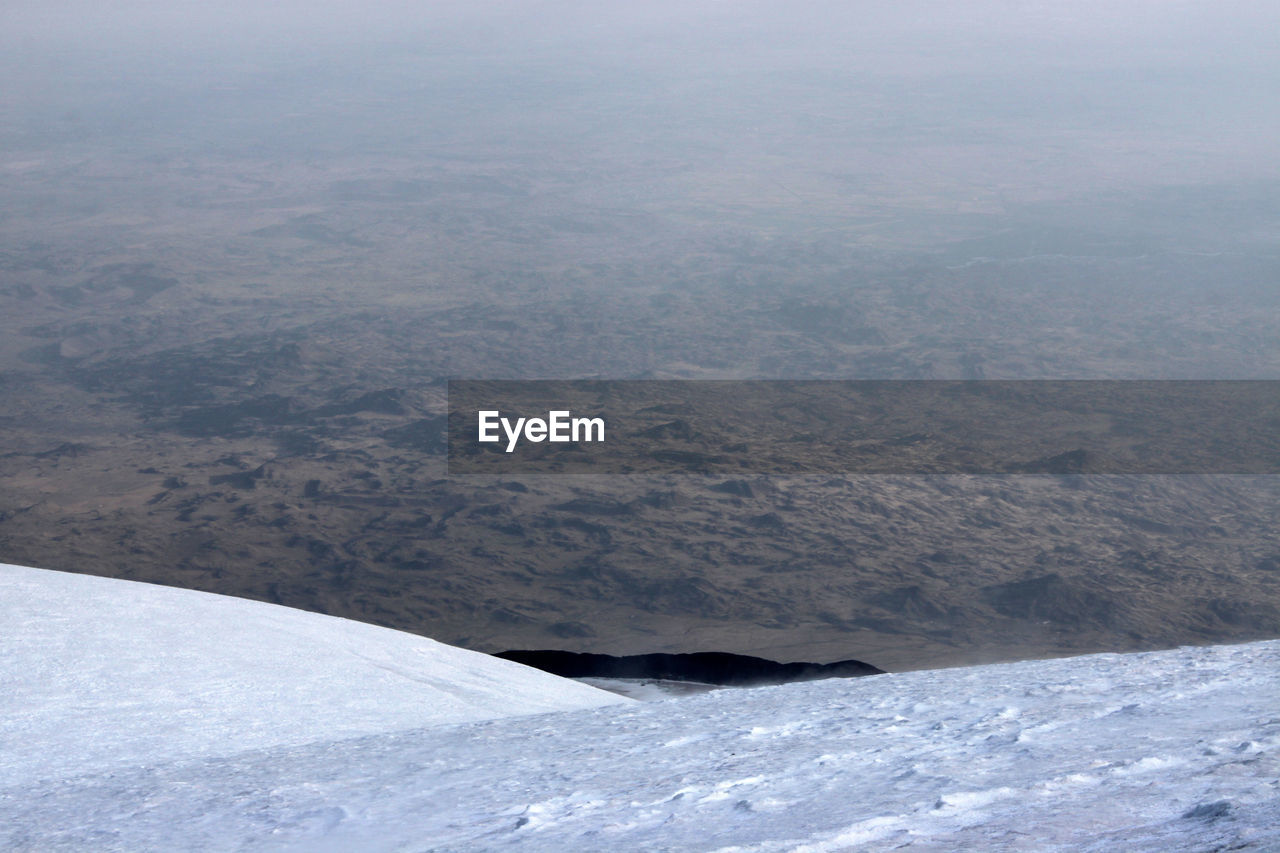 Scenic view of mountains against sky during winter