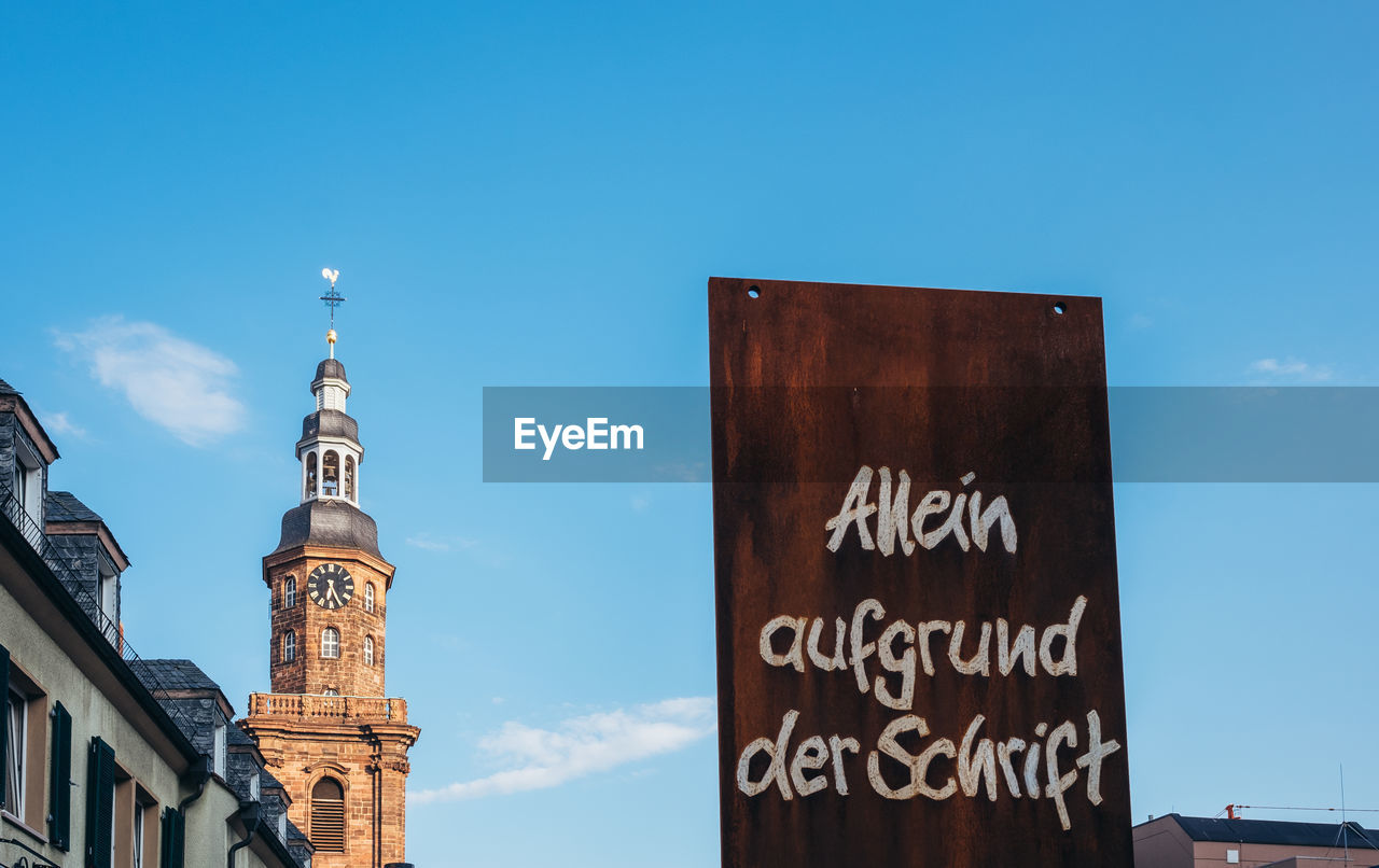 LOW ANGLE VIEW OF INFORMATION SIGN AGAINST SKY