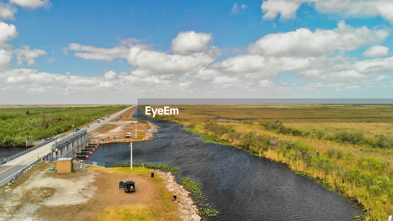 PANORAMIC VIEW OF ROAD PASSING THROUGH LANDSCAPE