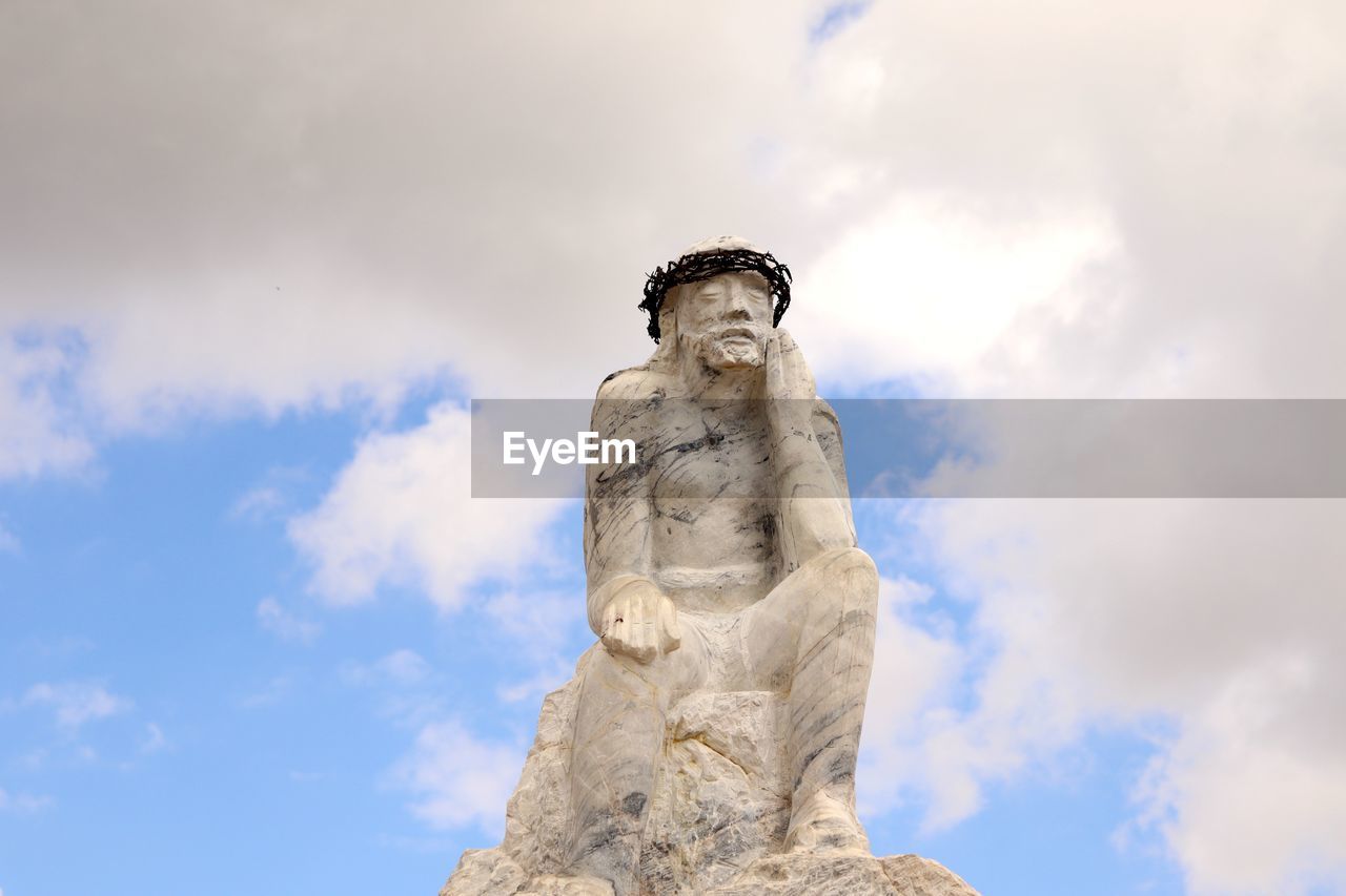 cloud, sculpture, sky, statue, human representation, representation, blue, craft, low angle view, nature, male likeness, history, creativity, monument, no people, architecture, the past, rock, art, day, travel destinations, landmark, temple, outdoors, travel, religion, memorial, stone material, spirituality