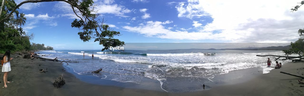 PANORAMIC VIEW OF BEACH AGAINST SKY