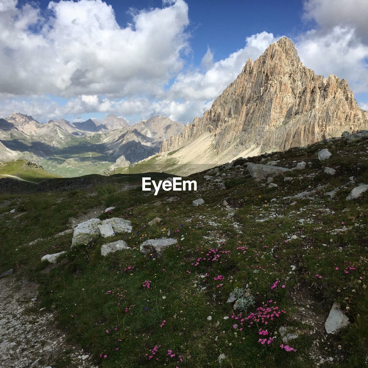 Scenic view of mountains against cloudy sky